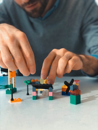 a man building a building blocks