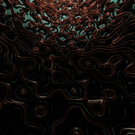 Abstract golden texture with delicate shimmering metallic highlights on a dark, moody backdrop.