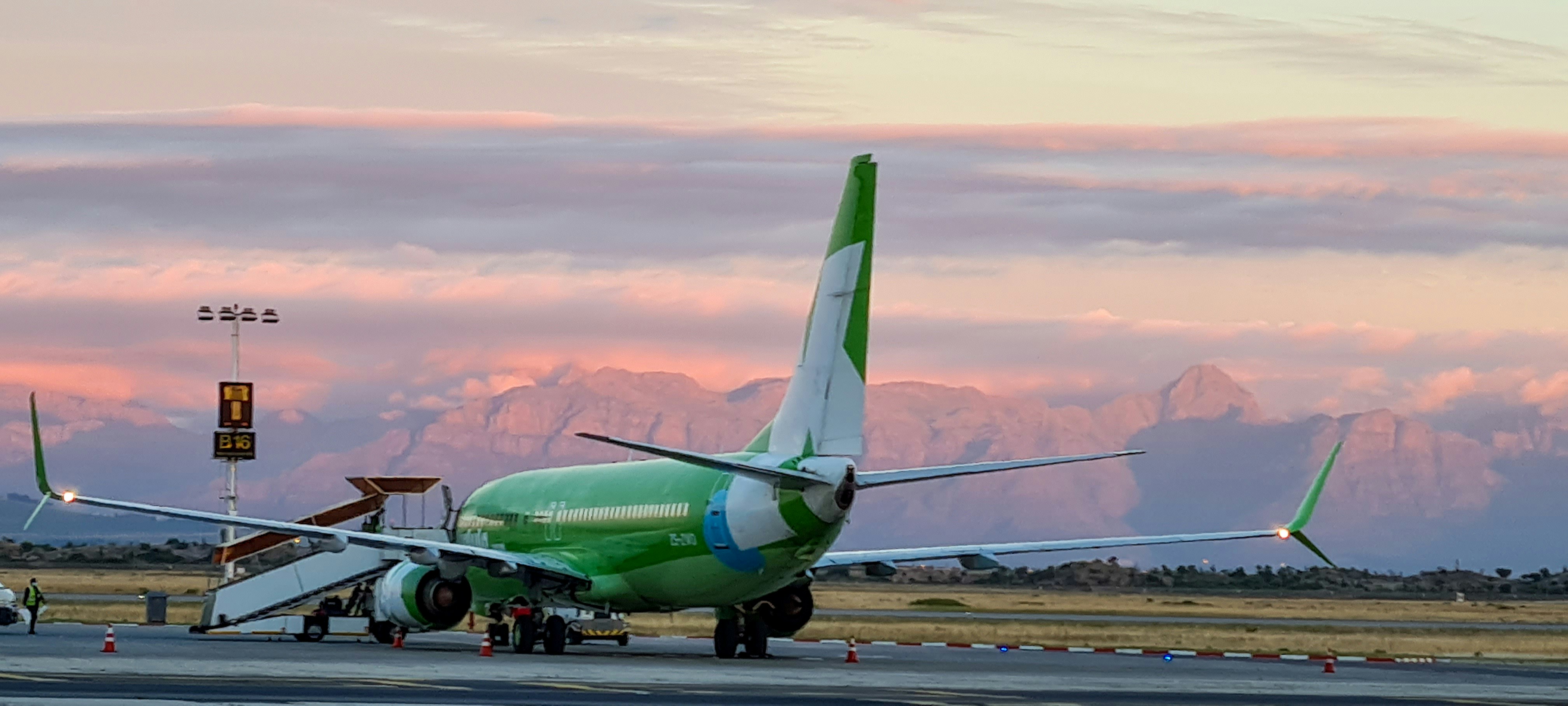 a large airplane on the runway, 