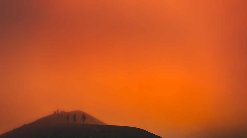 a sunset over a mountain