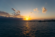 a sunset over a body of water