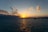 a sunset over a body of water