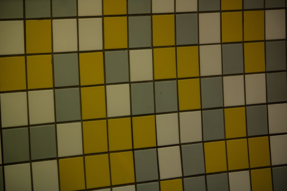 a yellow and blue tiled wall
