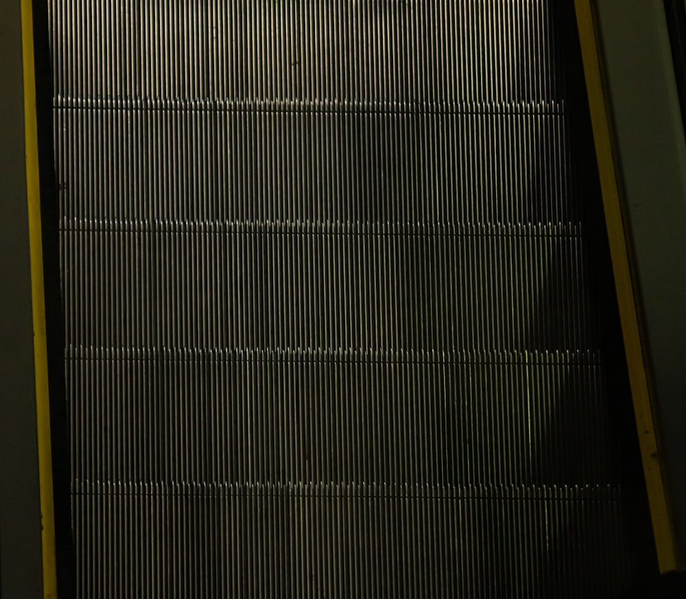 a black and yellow metal grate