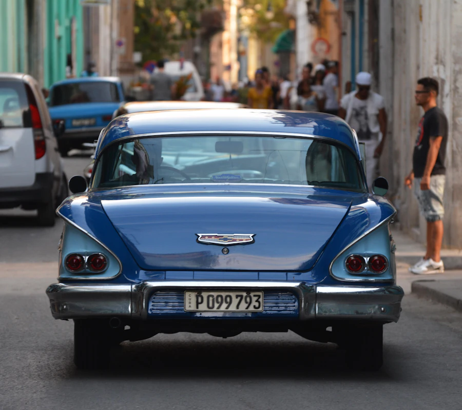 Blue classic car driving in Havana