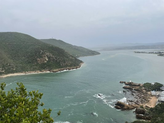 A beach with a body of water — Garden Route, South Africa