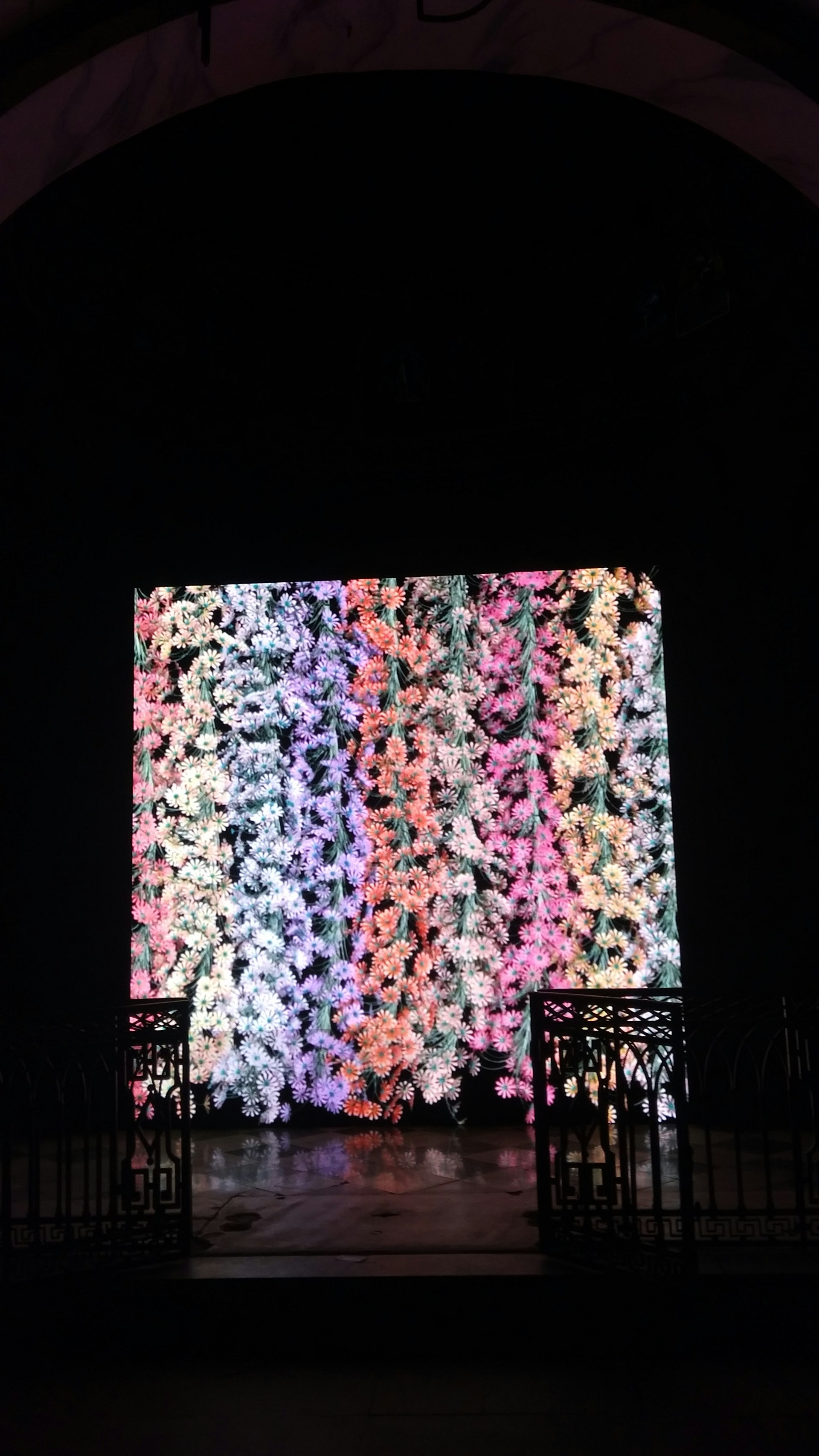 Close-up of a colorful digital artwork displayed on a high-resolution screen against a black background.