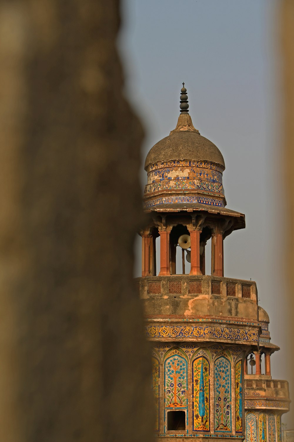 a tall building with a domed roof