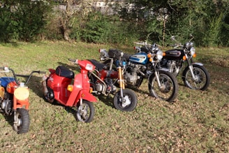 a group of motorcycles parked in a field