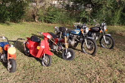 a group of motorcycles parked in a field