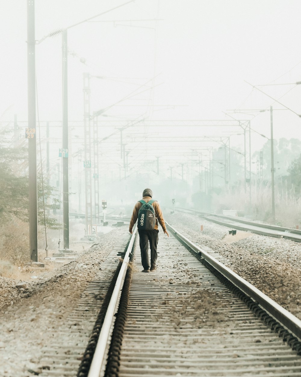 a person walking on train tracks