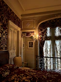 Elegant bedroom showcasing a floral wallpaper design that adds warmth and charm.