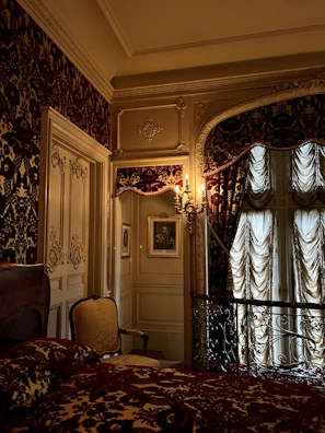 Elegant bedroom showcasing a floral wallpaper design that adds warmth and charm.