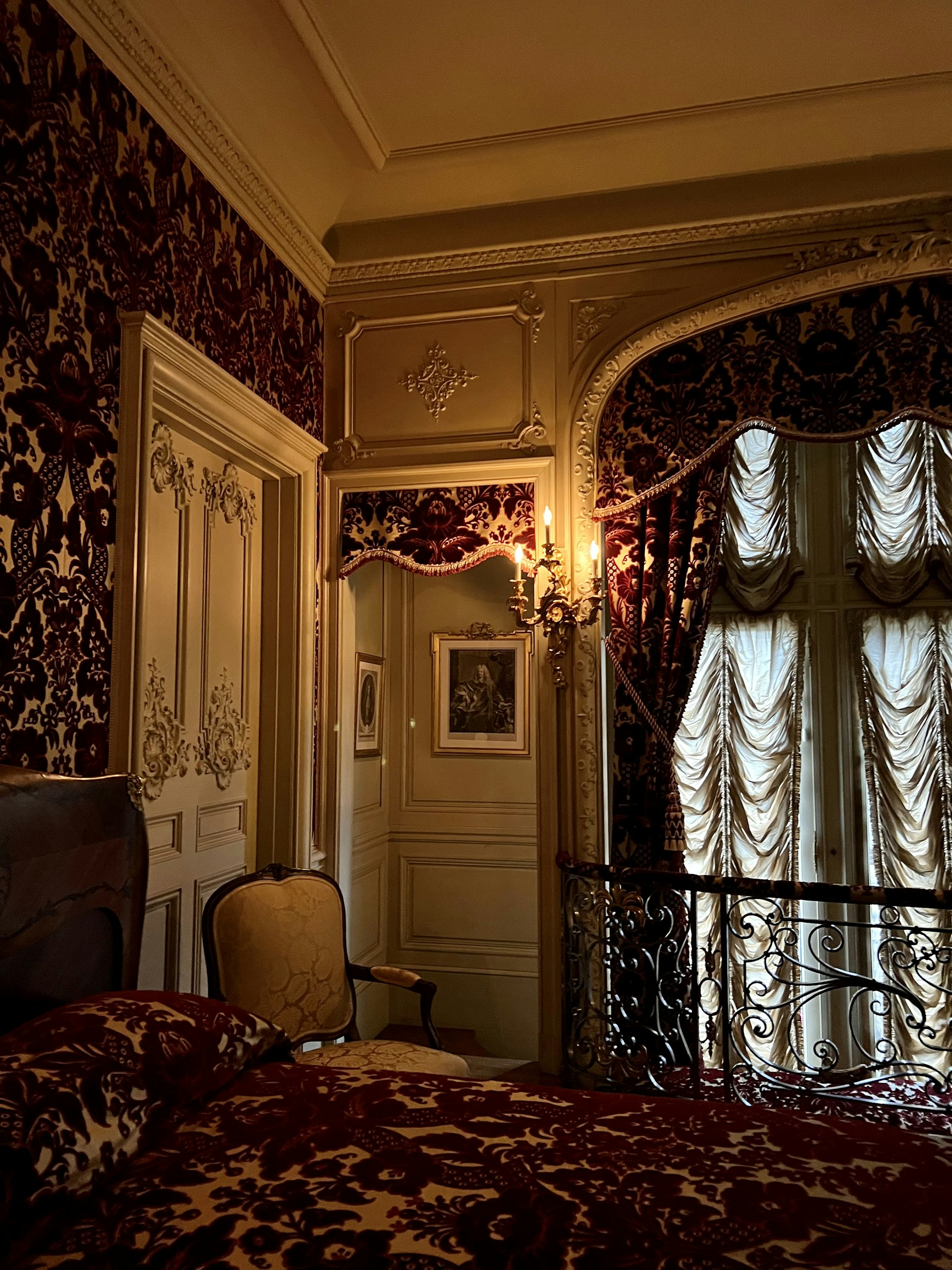 a bedroom with a bed and a chair
