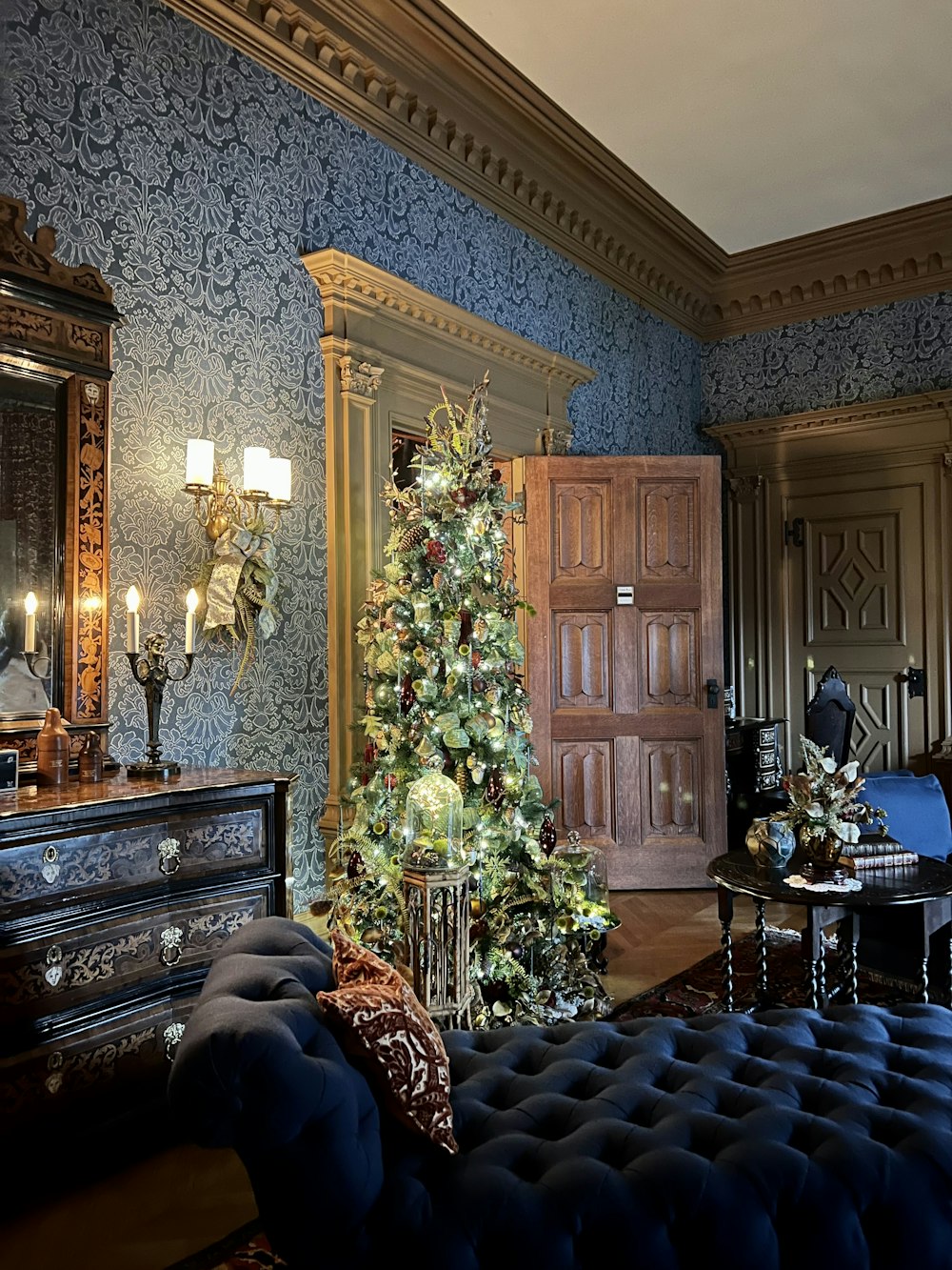 a room with a large tree and a couch