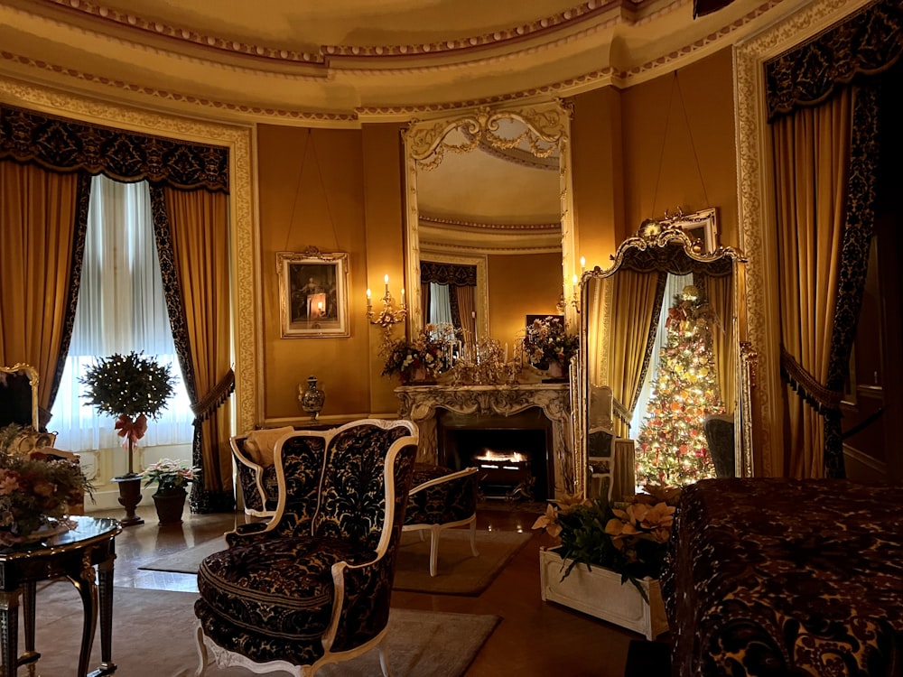 a room with a fireplace and chairs