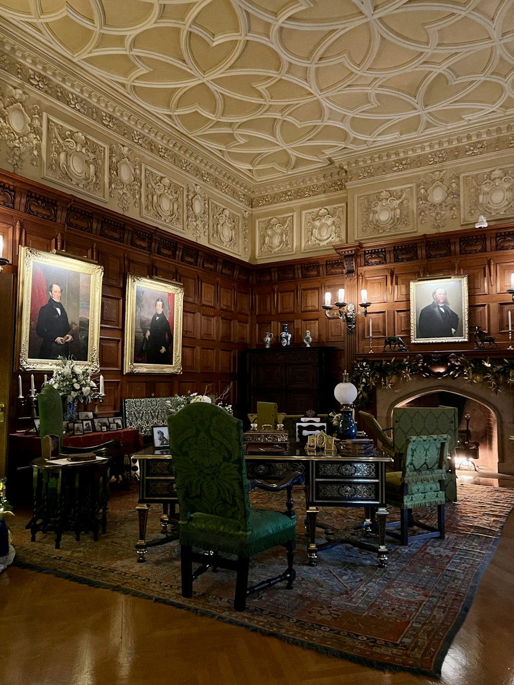 a room with a fireplace and chairs