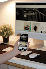 a hand holding a phone