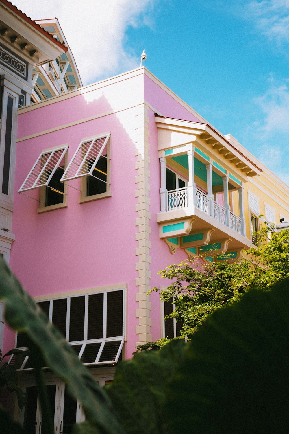 a pink building with windows