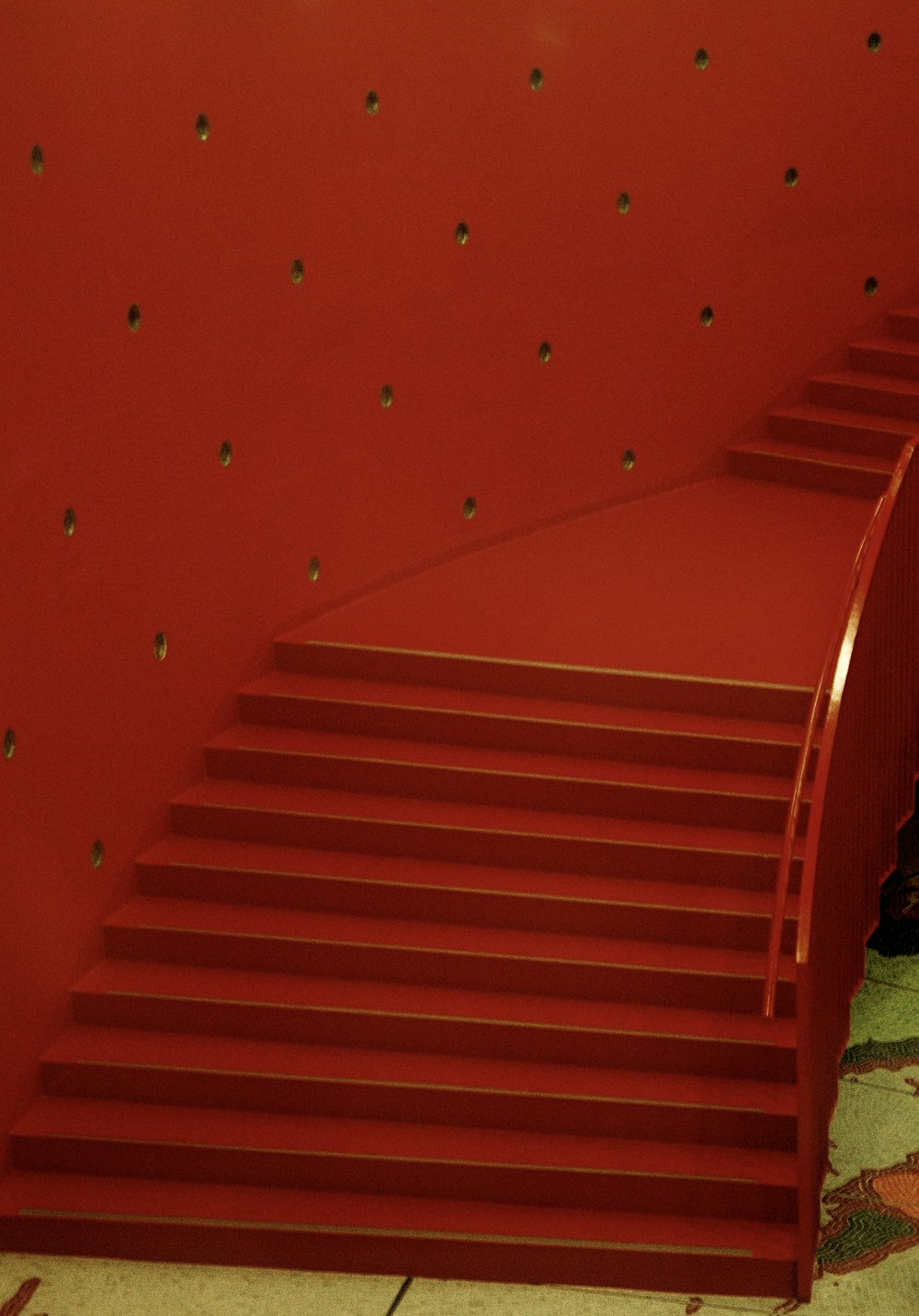 a set of stairs with red walls