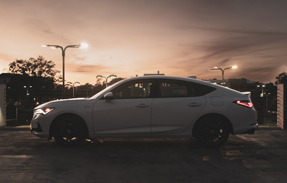 a white car parked on a street