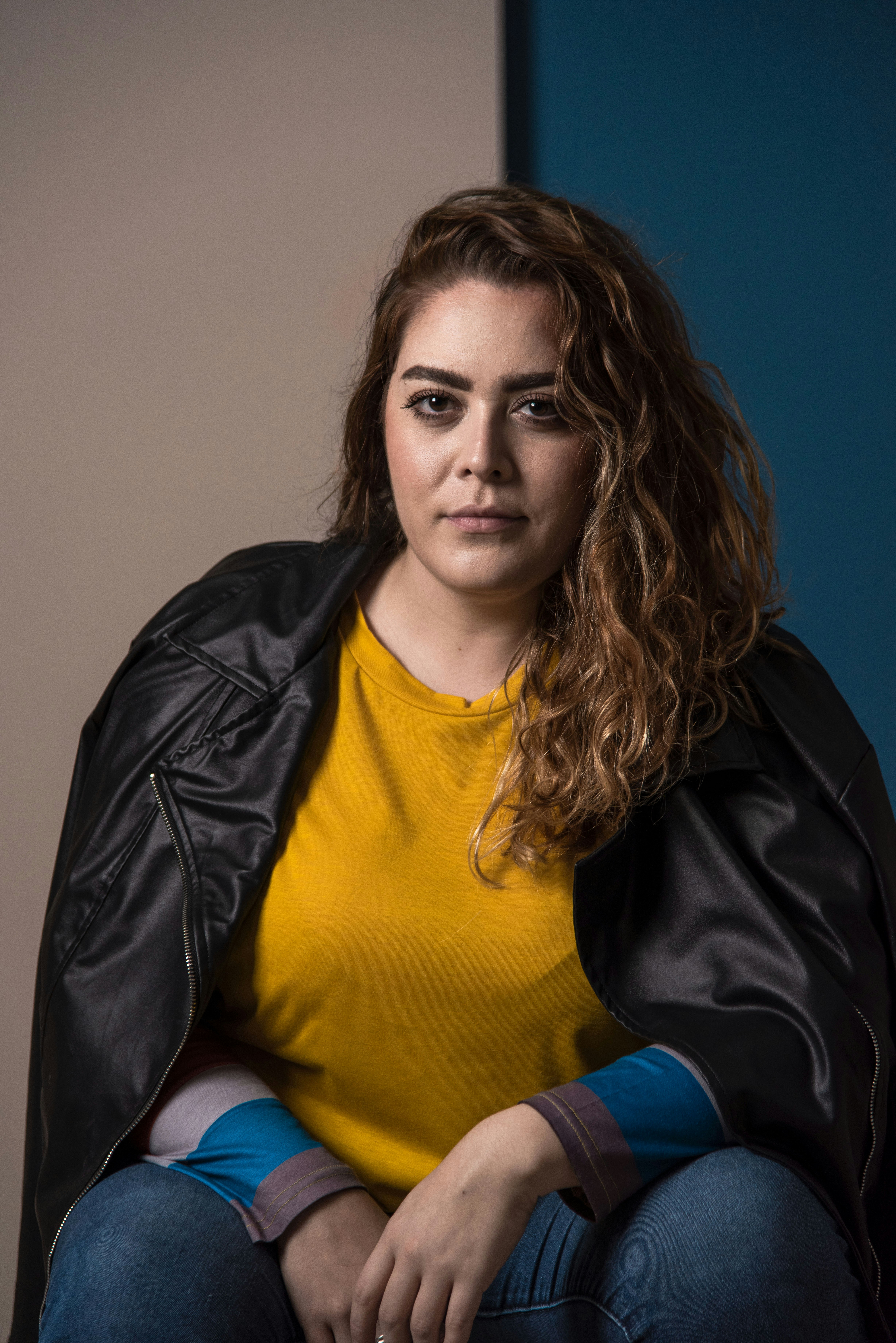 a woman sitting on a couch