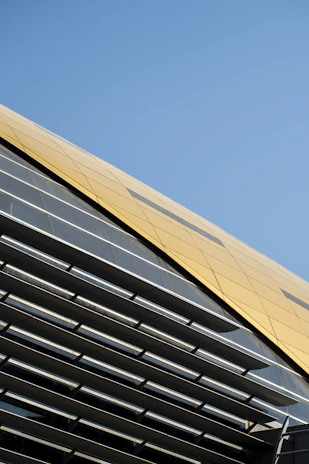 Modern aluminum structure with yellow and gray accents in a corporate setting