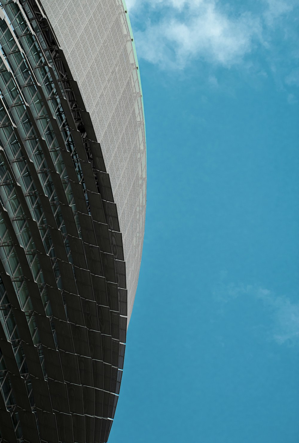 a tall building with a blue sky