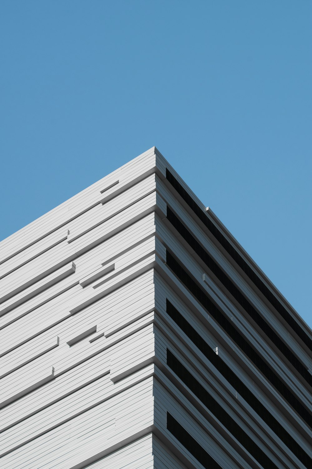 a tall building with a blue sky