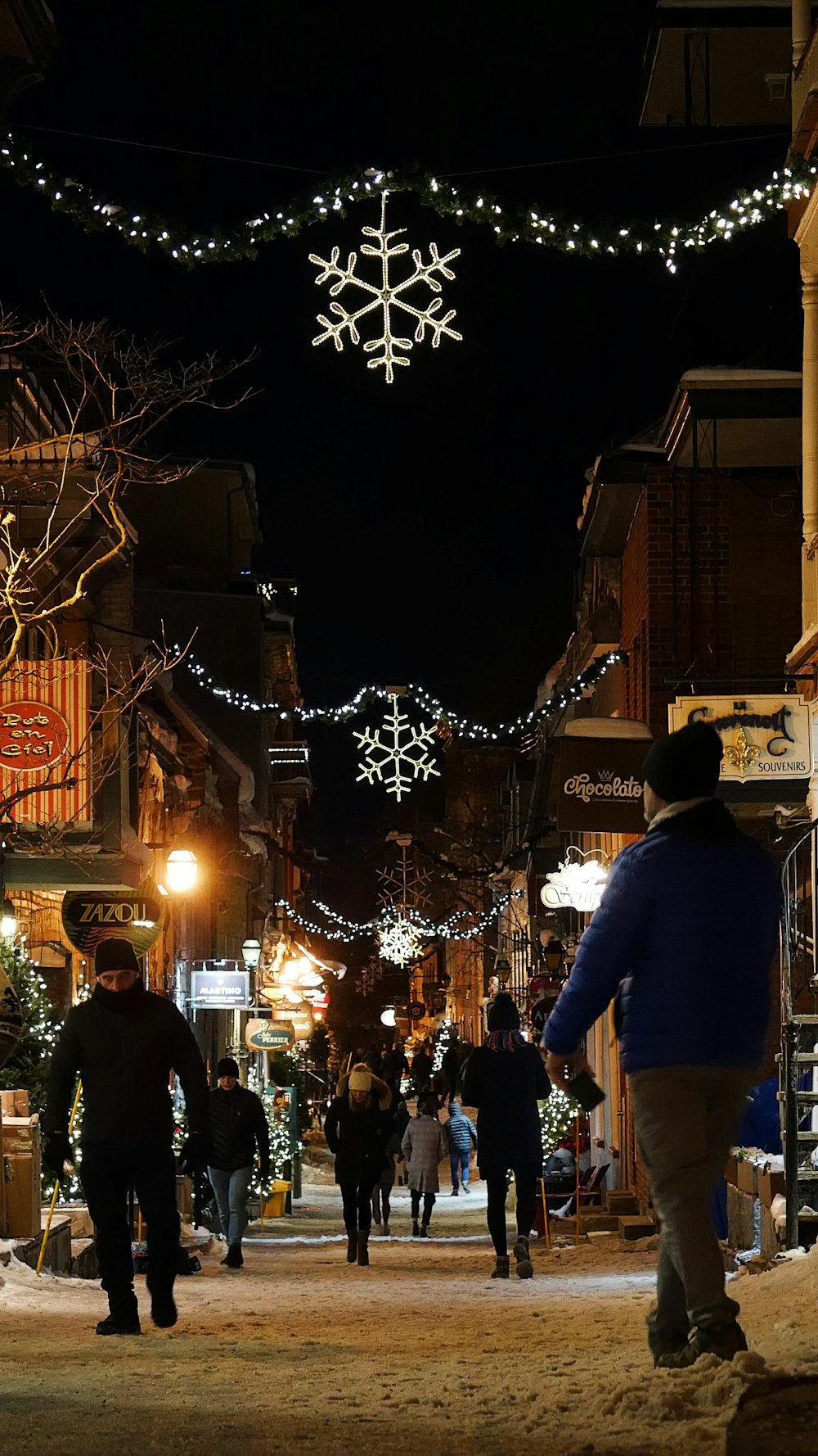 people walking in a snowy street