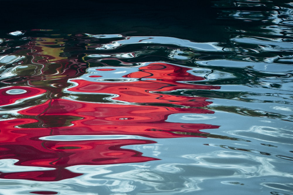 a body of water with red and white stripes