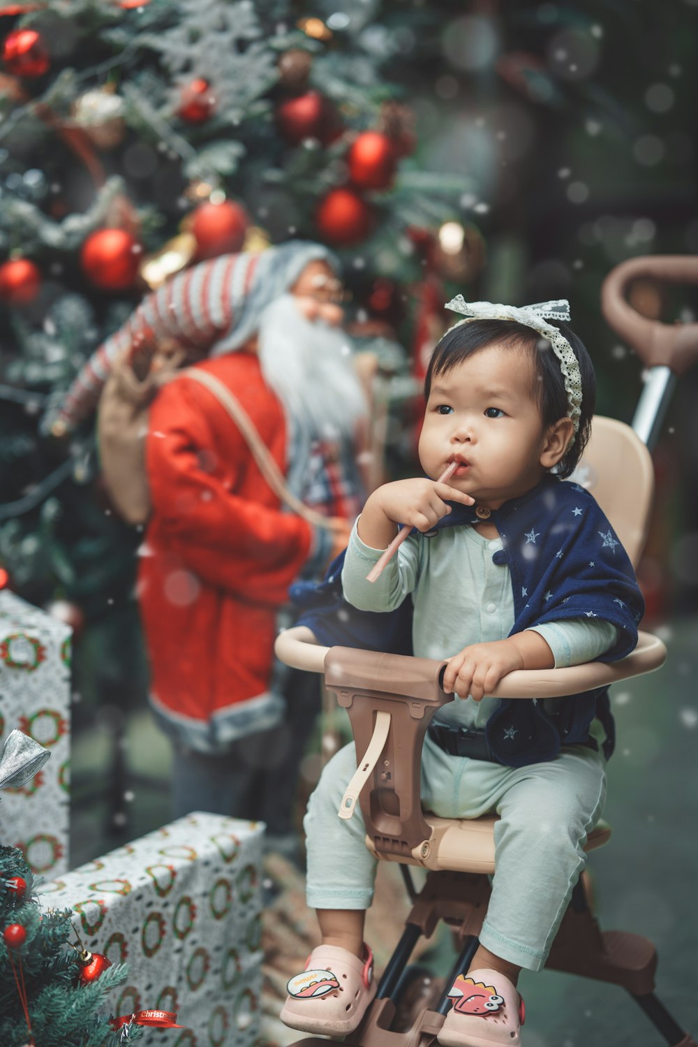 a baby sitting on a chair