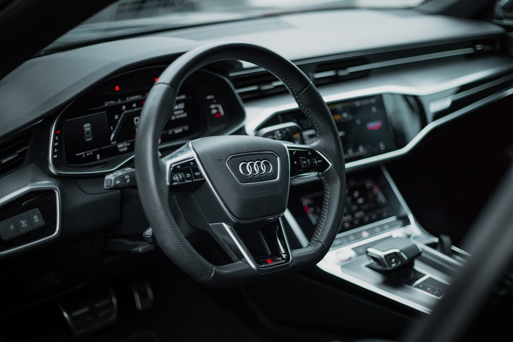 the steering wheel and dashboard of a car