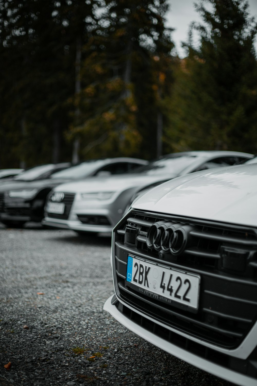 a row of cars parked in a parking lot