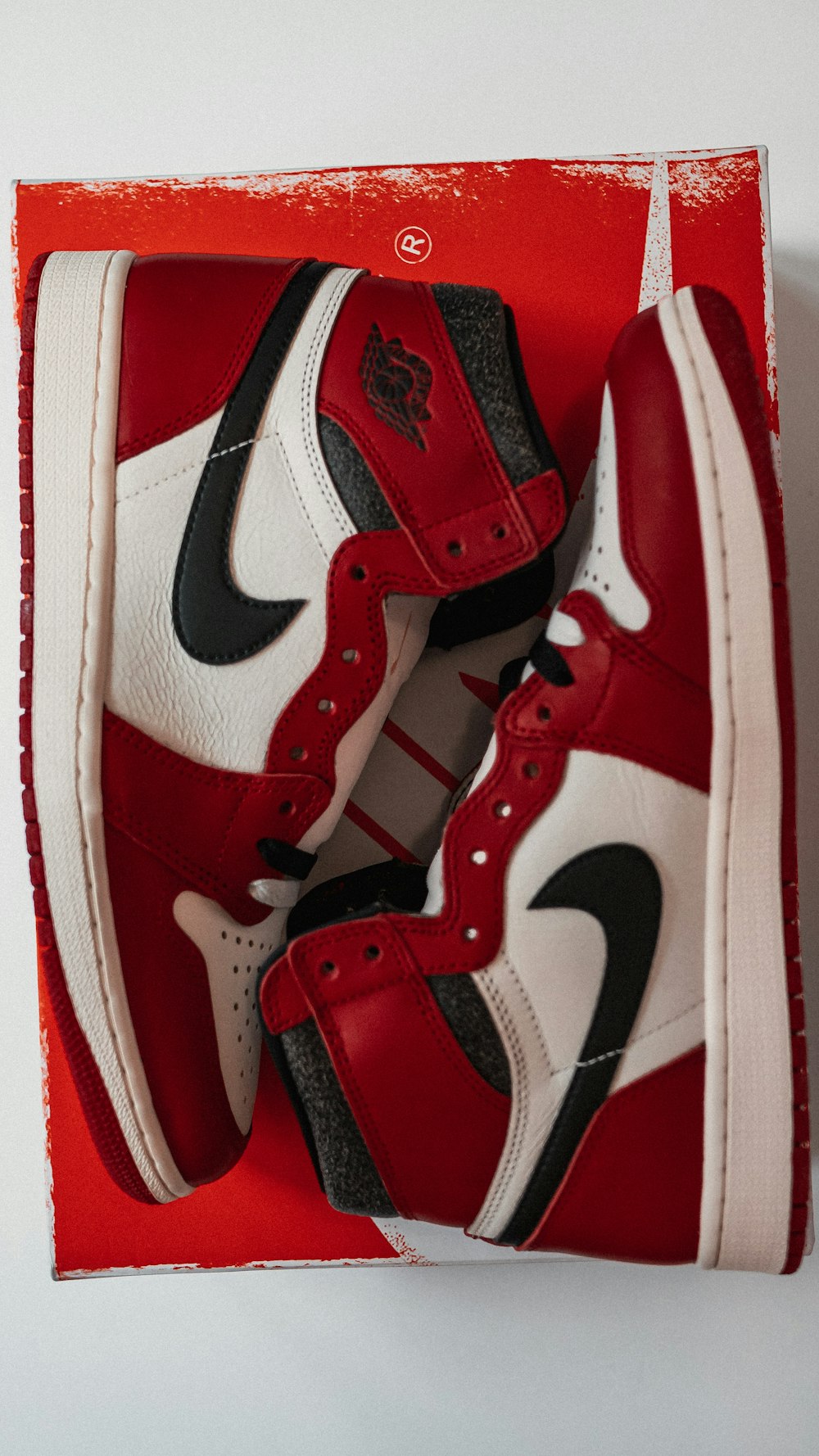 a pair of red and white sneakers