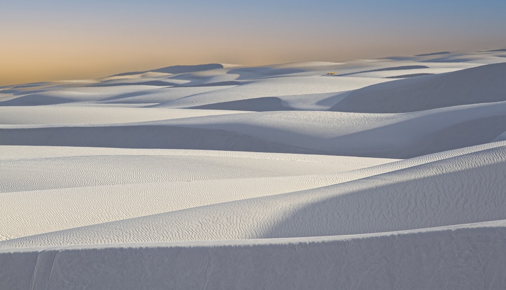 a desert landscape with sand dunes