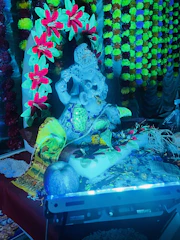 Close-up of traditional offerings and decorations during Gaura Purnima.