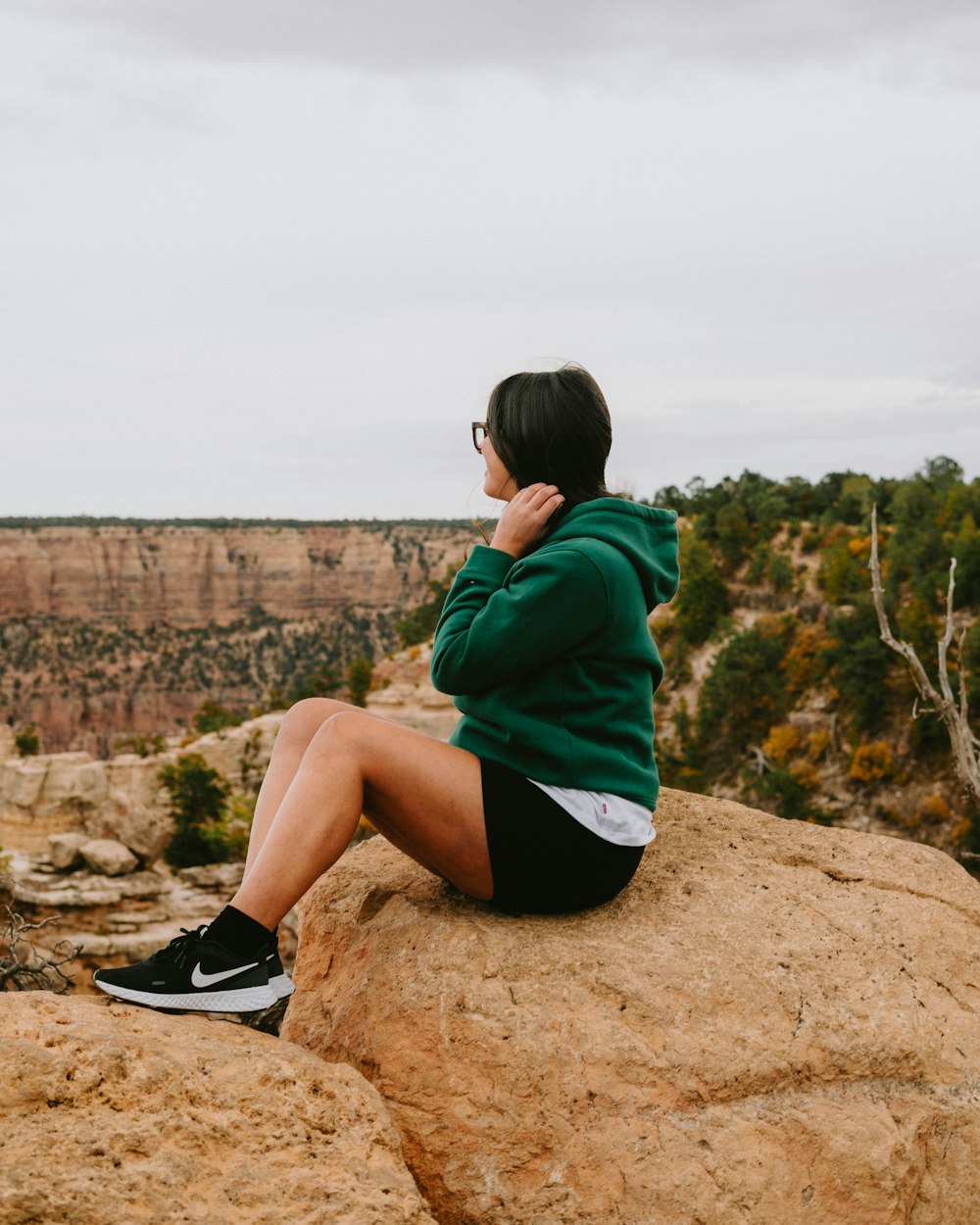 a man sitting on a rock