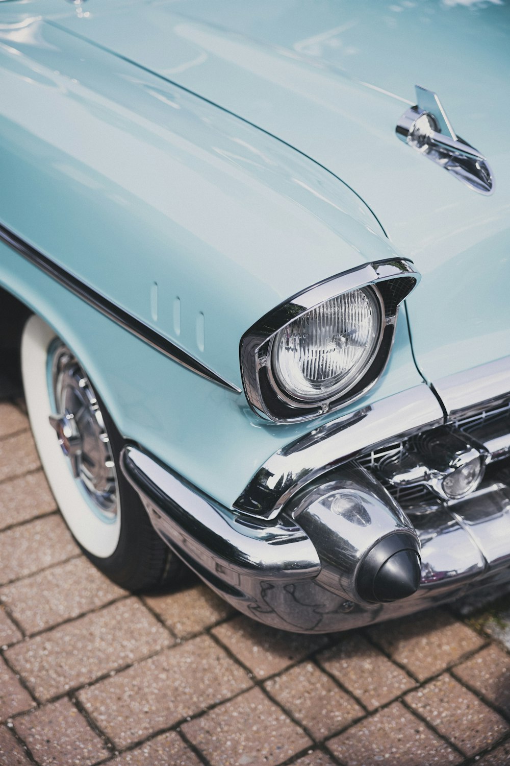 a car parked on a brick road