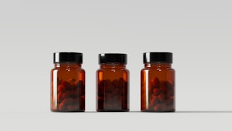 a group of jars with different colored contents