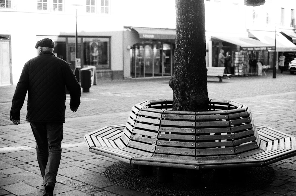 a man walking down a sidewalk