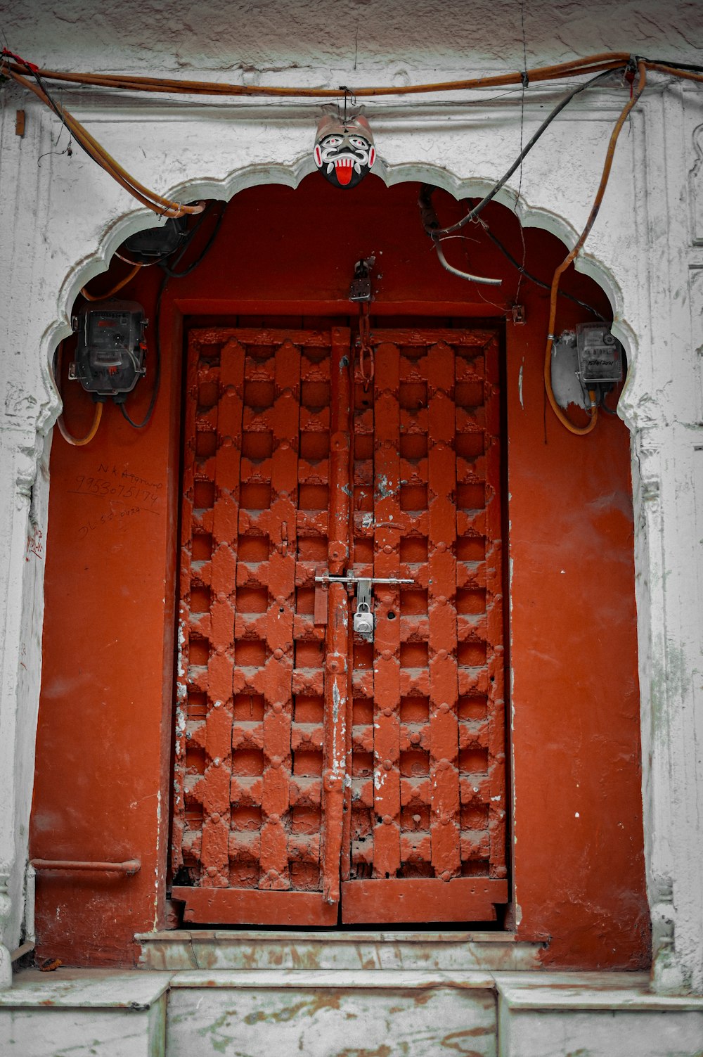 a red door with a metal frame
