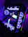 A sleek gaming desktop setup glowing with RGB lights in a modern showroom.