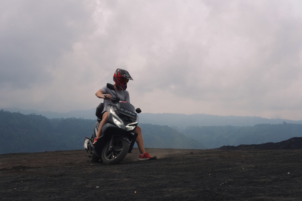 a man sitting on a motorcycle