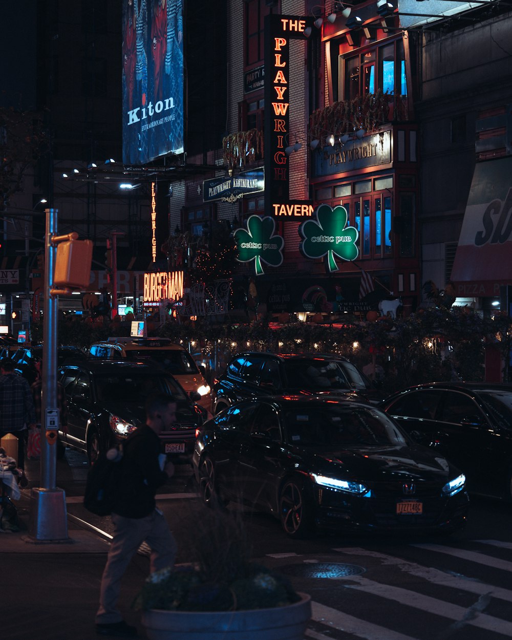 a busy city street at night