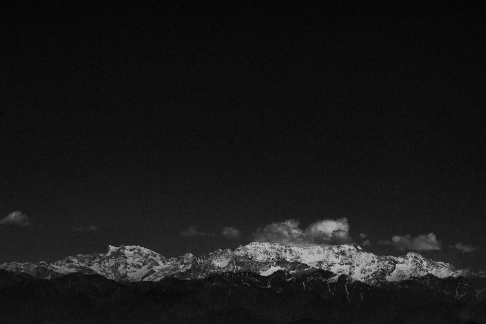 a black and white photo of clouds in the sky