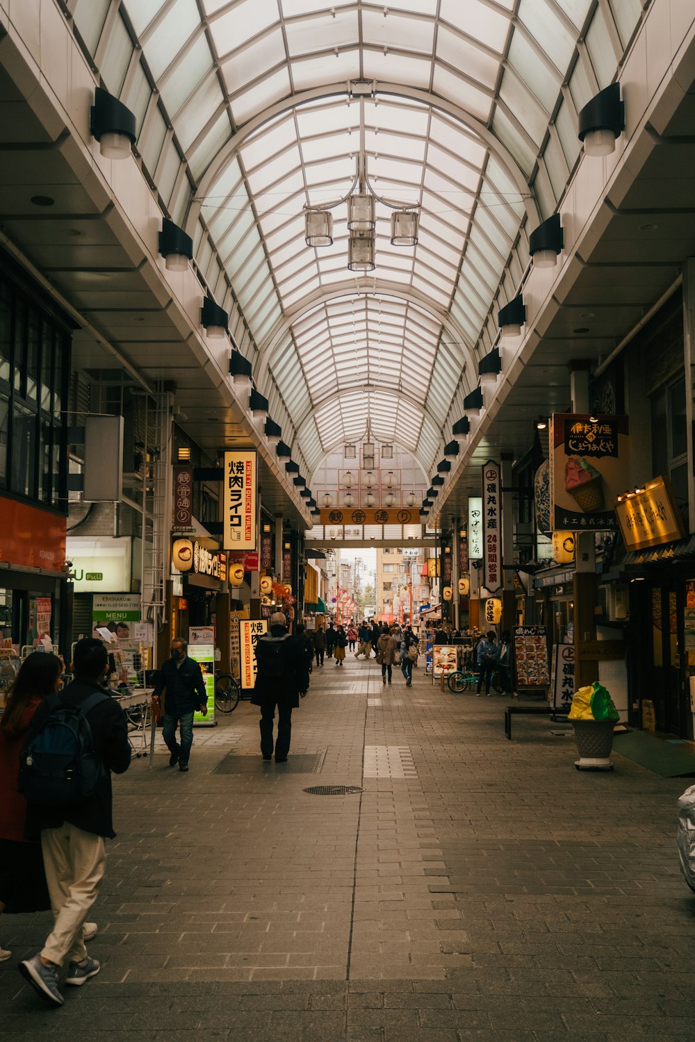 a group of people walking in a large building