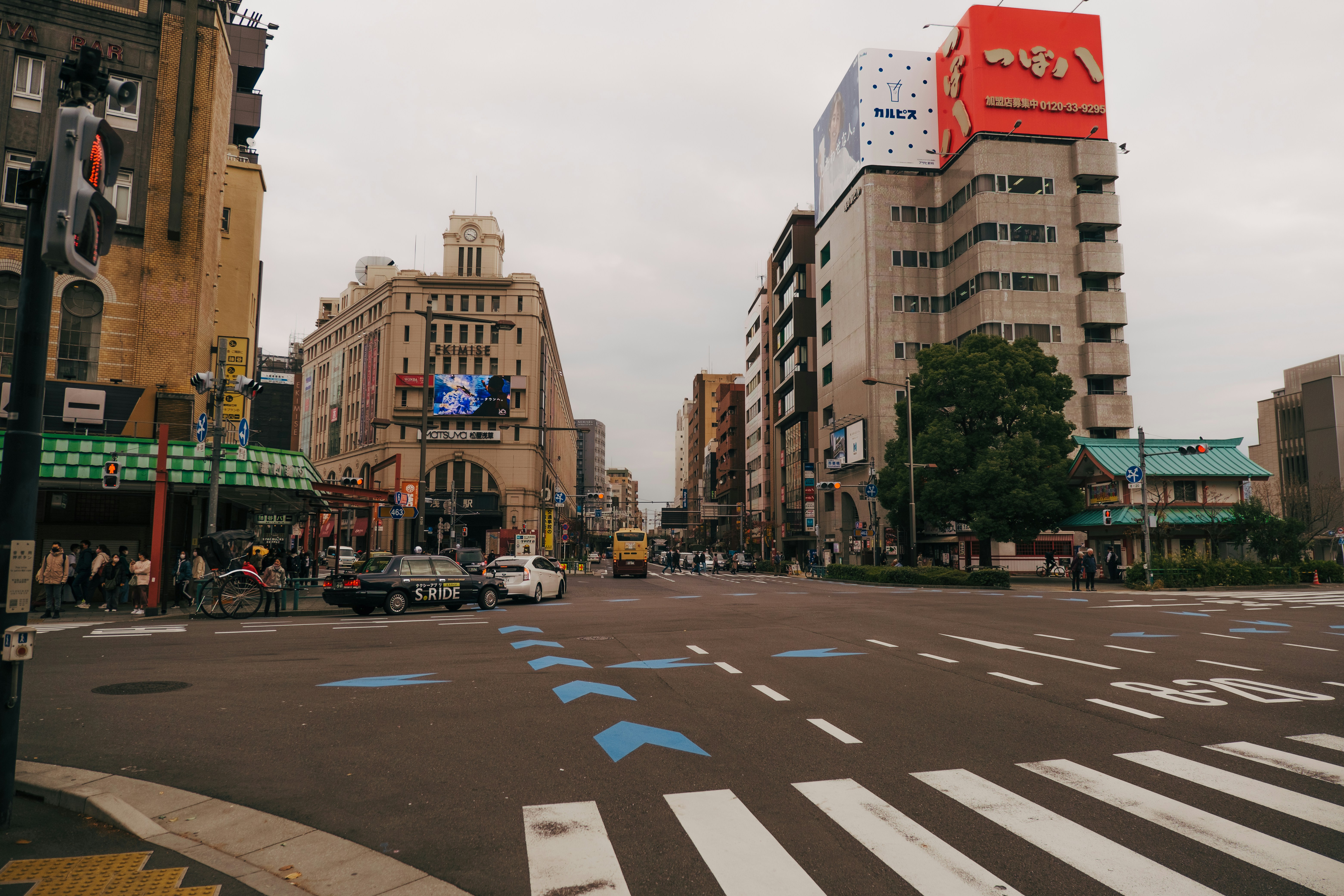a city street with cars and buildings