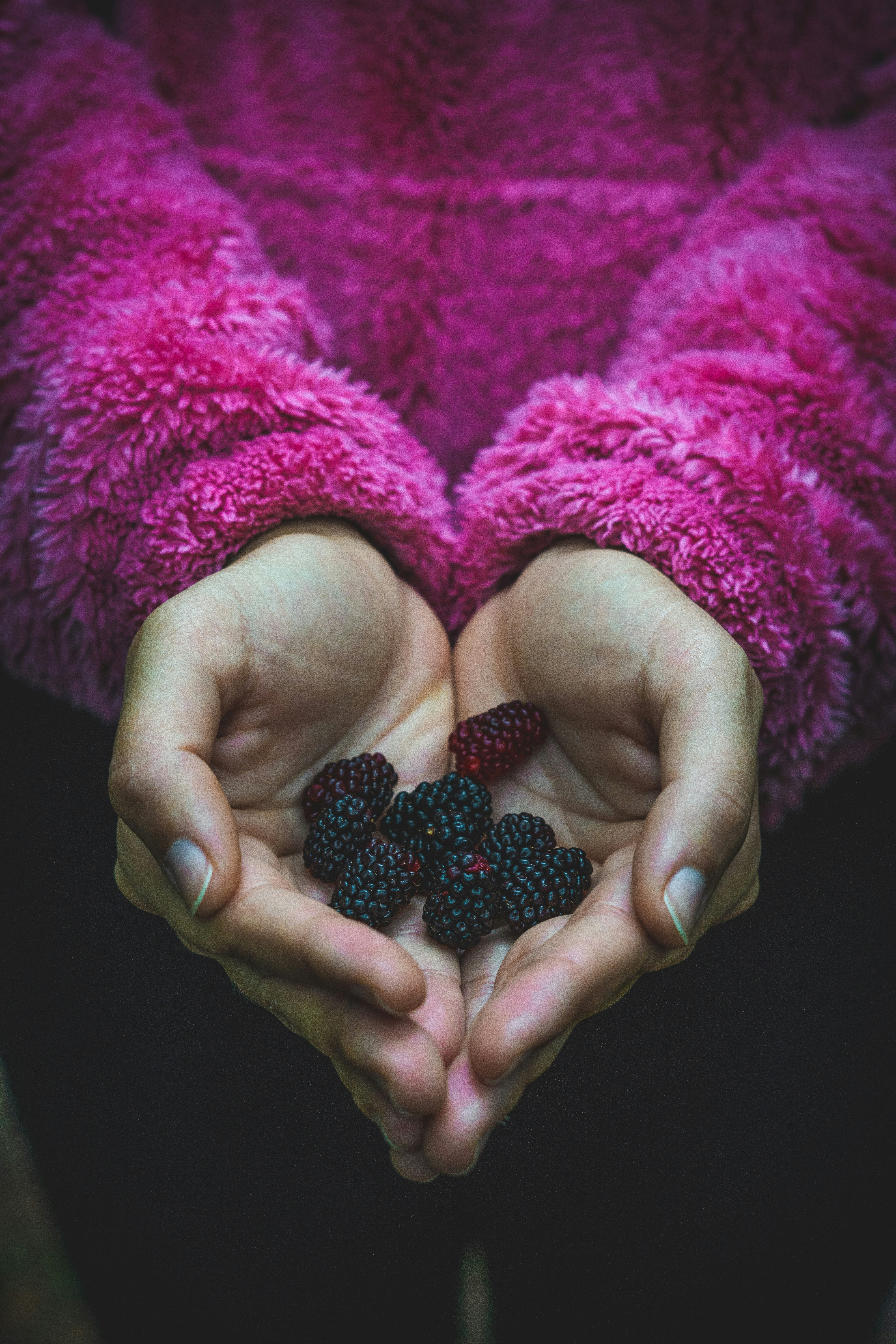 a person holding a small black object