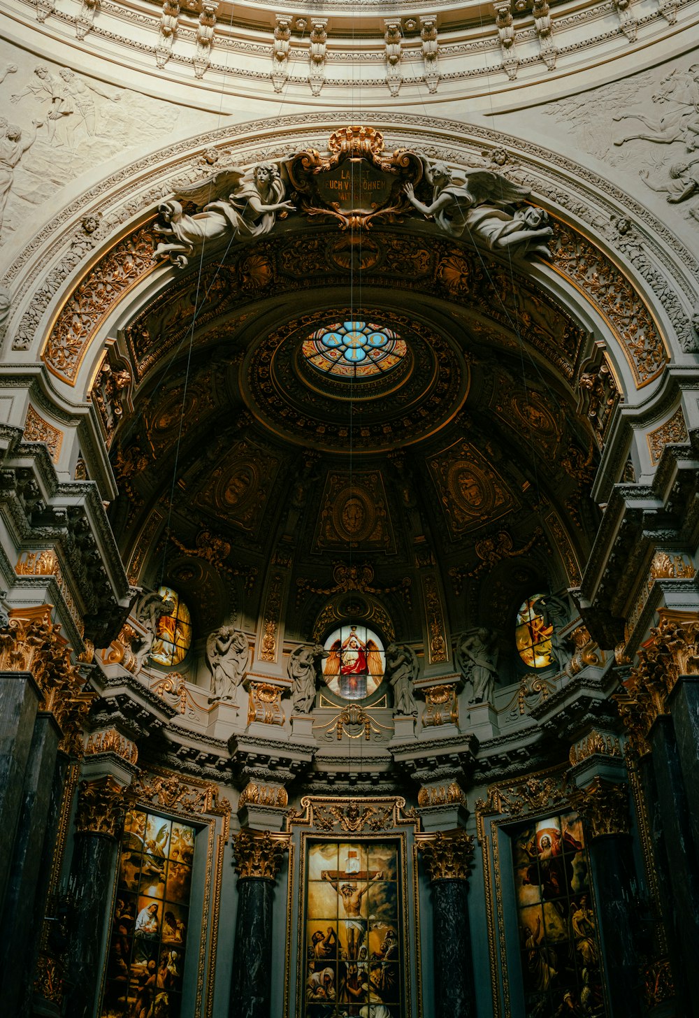 a large ornate ceiling with paintings